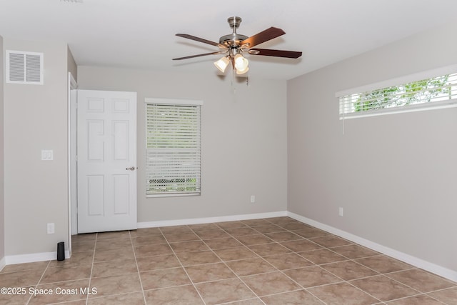 1610 Yahner St SE, Palm Bay, FL 32909 - tiled empty room featuring ceiling fan and baseboards