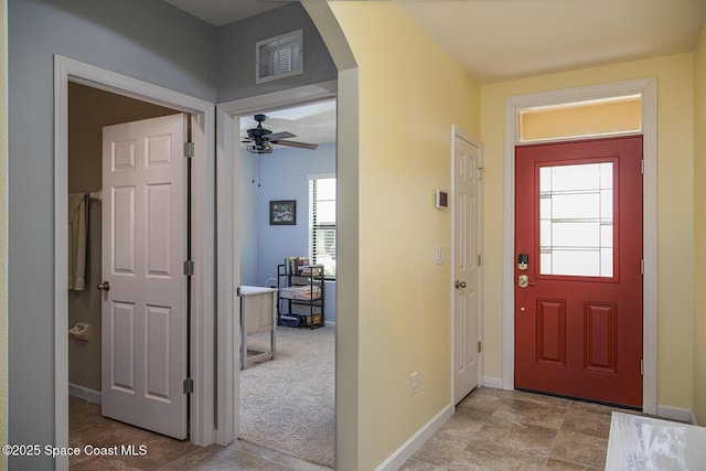 3847 Loggerhead Ln, Mims, FL 32754 - entryway with arched walkways, baseboards, and a ceiling fan