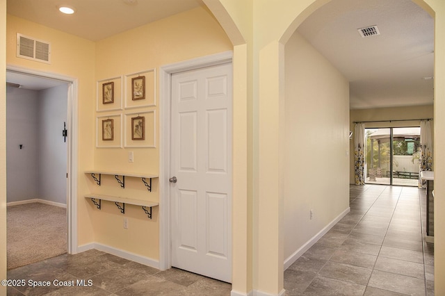 3847 Loggerhead Ln, Mims, FL 32754 - hallway featuring baseboards, arched walkways, and recessed lighting