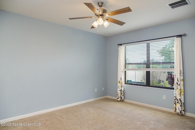 3847 Loggerhead Ln, Mims, FL 32754 - empty room with light colored carpet, baseboards, and a ceiling fan