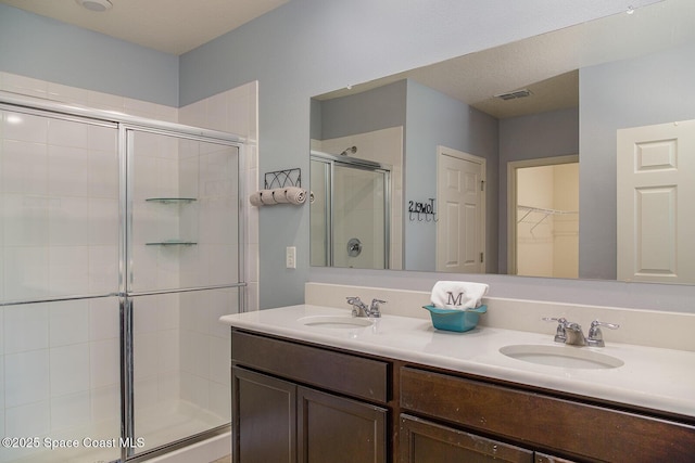 3847 Loggerhead Ln, Mims, FL 32754 - full bath with a stall shower, double vanity, and a spacious closet