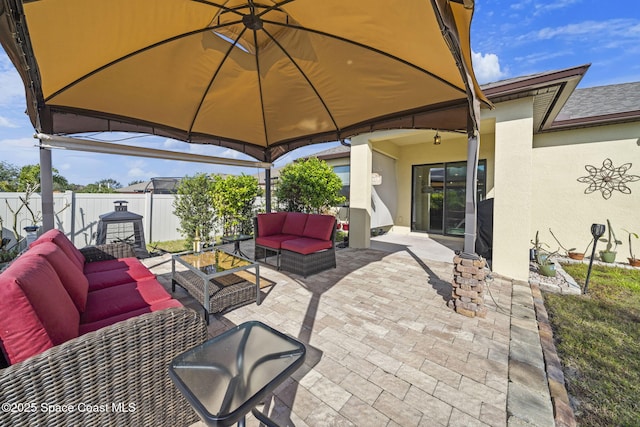 3847 Loggerhead Ln, Mims, FL 32754 - view of patio featuring a gazebo, an outdoor living space, and fence