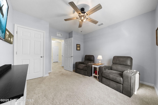 3847 Loggerhead Ln, Mims, FL 32754 - living area featuring carpet flooring, a ceiling fan, and baseboards