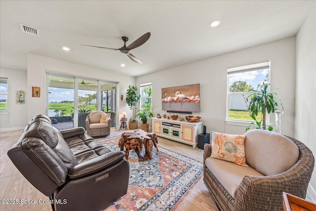 2902 Tidepool Pl, Melbourne, FL 32940 - living room with ceiling fan, light wood-type flooring, recessed lighting, and baseboards
