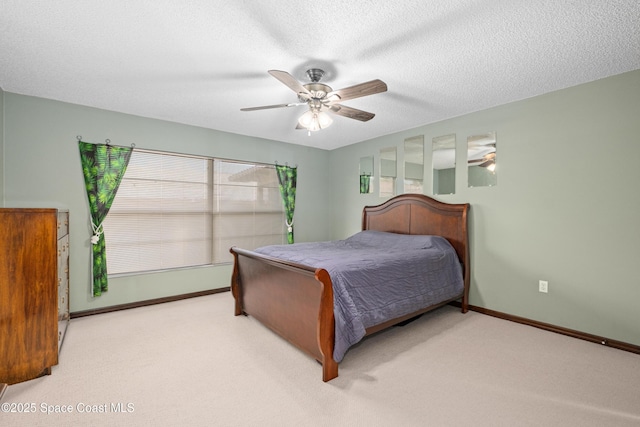 1170 Faulkingham Rd, Merritt Island, FL 32952 - carpeted bedroom with multiple windows, ceiling fan, baseboards, and a textured ceiling