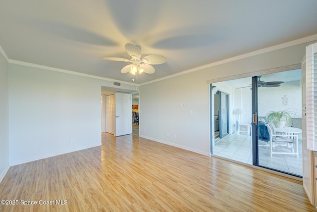 spare room featuring a ceiling fan, light wood-style floors, baseboards, and crown molding