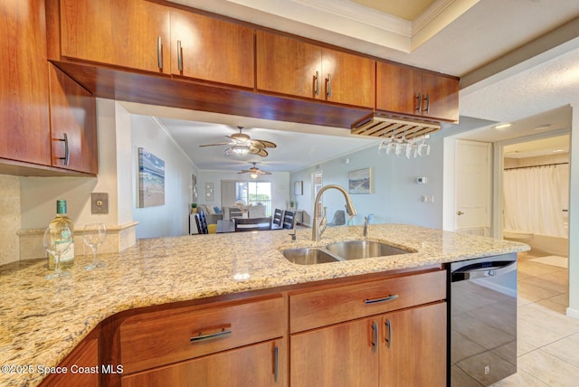 kitchen with a sink, stainless steel dishwasher, ornamental molding, light tile patterned flooring, and ceiling fan