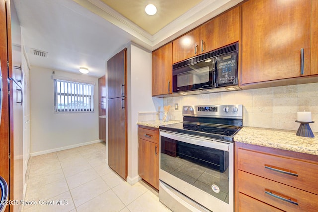 kitchen with black microwave, stainless steel range with electric cooktop, tasteful backsplash, baseboards, and light tile patterned floors