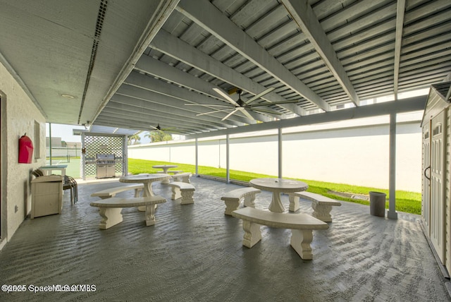 view of patio / terrace with fence and ceiling fan