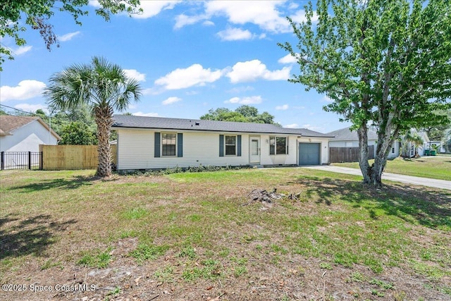 single story home featuring a garage and driveway