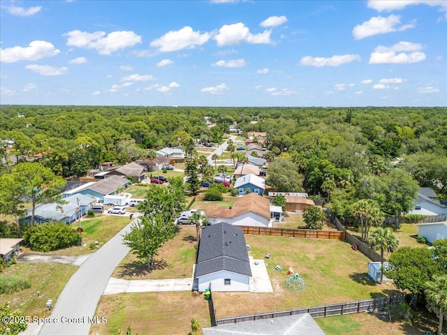 aerial perspective of suburban area with a forest