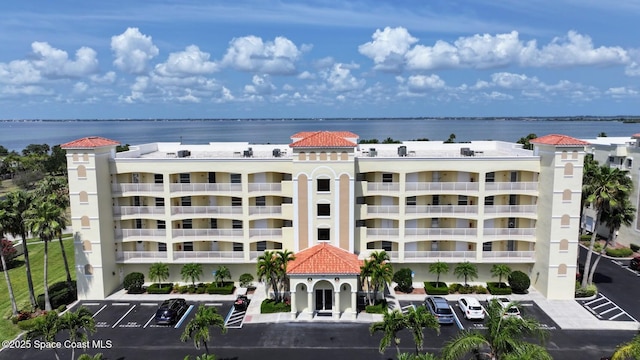 732 Bayside Dr Unit 501, Cape Canaveral, FL 32920 - view of apartment building / complex with uncovered parking and a water view