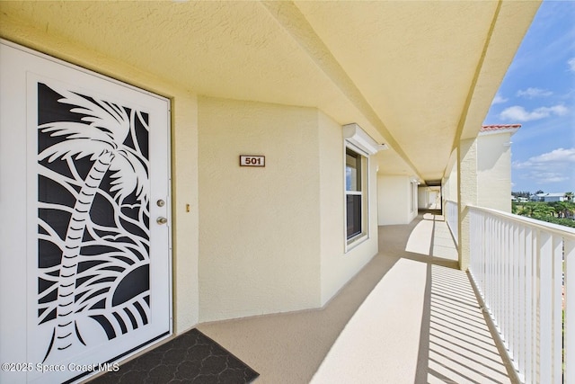 732 Bayside Dr Unit 501, Cape Canaveral, FL 32920 - doorway to property featuring a balcony and stucco siding