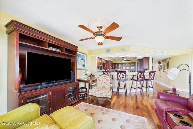 732 Bayside Dr Unit 501, Cape Canaveral, FL 32920 - living room featuring wood finished floors, ceiling fan, and baseboards