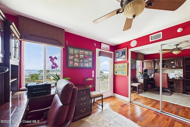732 Bayside Dr Unit 501, Cape Canaveral, FL 32920 - office featuring a ceiling fan and wood finished floors