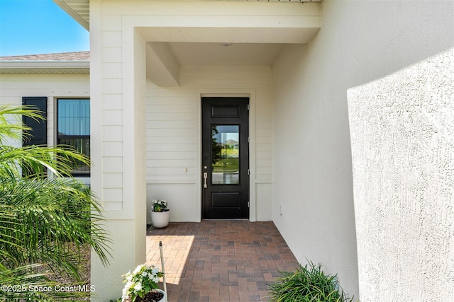 1342 Great Belt Cir, Melbourne, FL 32940 - doorway to property with a shingled roof