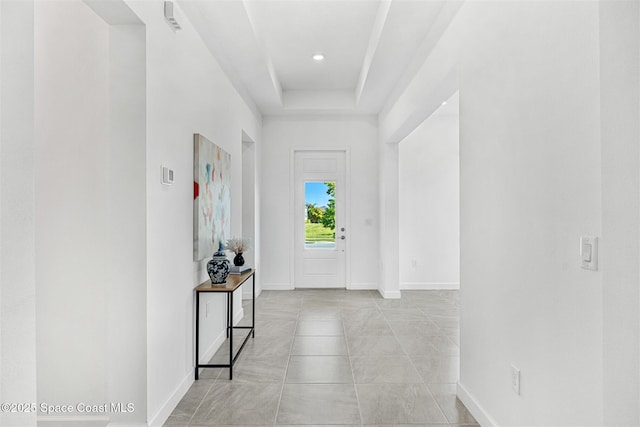1342 Great Belt Cir, Melbourne, FL 32940 - hall with baseboards and a tray ceiling