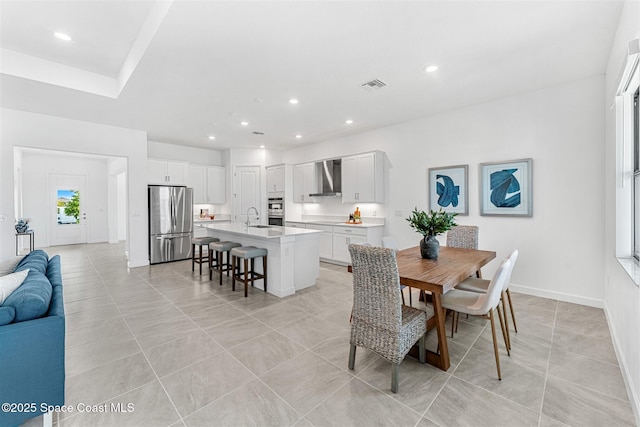 1342 Great Belt Cir, Melbourne, FL 32940 - dining area with recessed lighting, light tile patterned floors, and baseboards