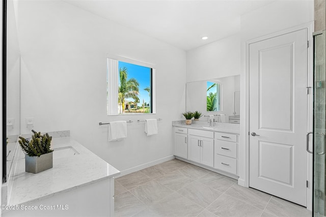 1342 Great Belt Cir, Melbourne, FL 32940 - bathroom featuring vanity, a shower stall, recessed lighting, marble look tiles, and baseboards