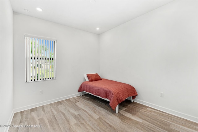 1342 Great Belt Cir, Melbourne, FL 32940 - bedroom with wood finished floors, baseboards, and recessed lighting