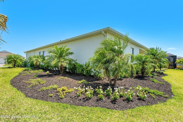 1342 Great Belt Cir, Melbourne, FL 32940 - view of home's exterior with stucco siding and a yard
