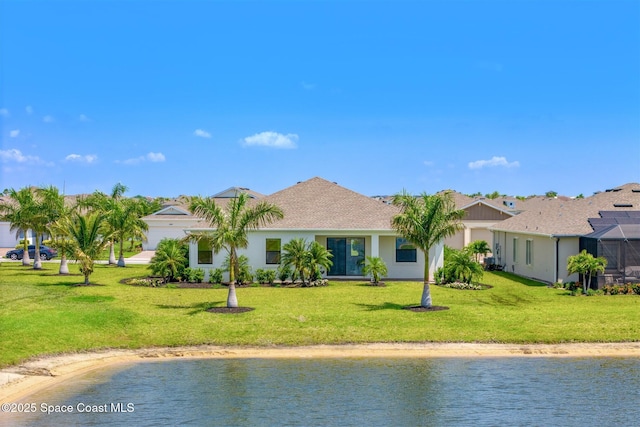 1342 Great Belt Cir, Melbourne, FL 32940 - rear view of property featuring a water view, a yard, and stucco siding