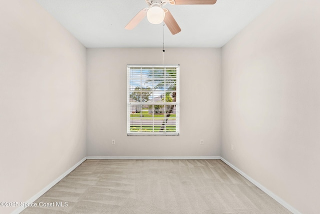 4882 Worthington Cir, Rockledge, FL 32955 - spare room with baseboards, light carpet, and a ceiling fan