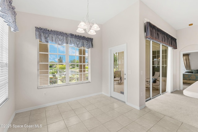 4882 Worthington Cir, Rockledge, FL 32955 - unfurnished dining area with a chandelier, baseboards, and tile patterned floors