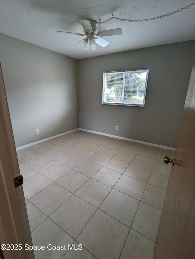 1600 University Ln Unit 1504, Cocoa, FL 32922 - unfurnished room featuring light tile patterned floors, a ceiling fan, and baseboards
