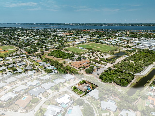 aerial perspective of suburban area featuring a nearby body of water