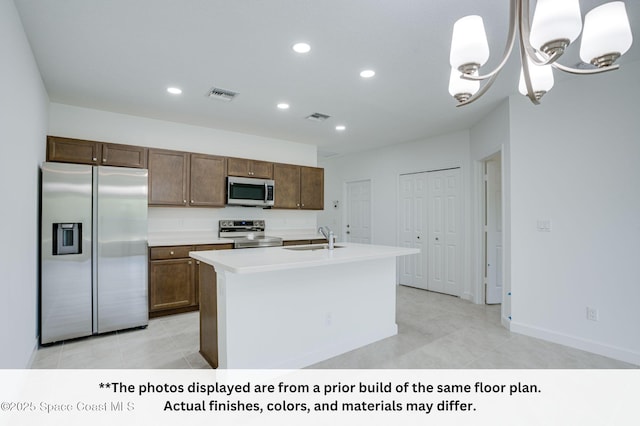 125 Admiral Cir, Sebastian, FL 32958 - kitchen featuring stainless steel appliances, a sink, recessed lighting, light countertops, and light tile patterned floors