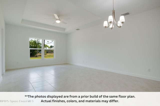 125 Admiral Cir, Sebastian, FL 32958 - unfurnished room featuring a tray ceiling, ceiling fan, a chandelier, light tile patterned floors, and baseboards