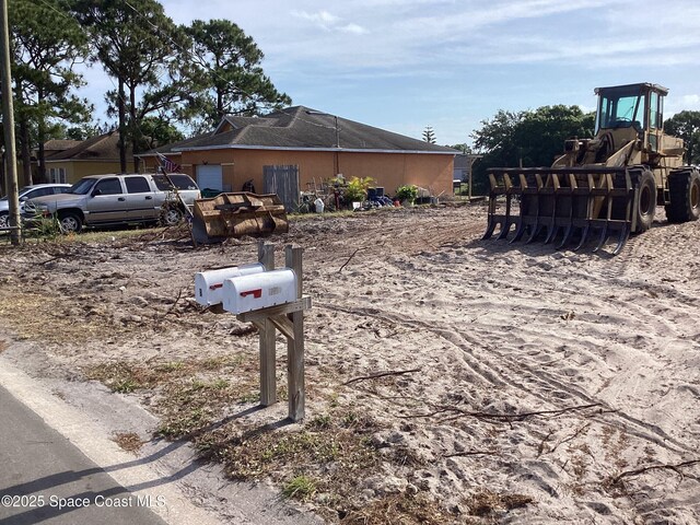 125 Admiral Cir, Sebastian, FL 32958 - view of property exterior with an attached garage