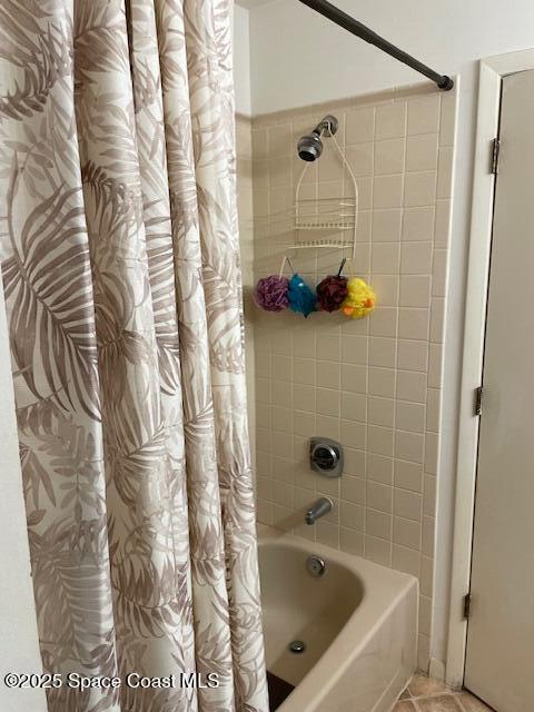 bathroom featuring shower / tub combo and tile patterned flooring