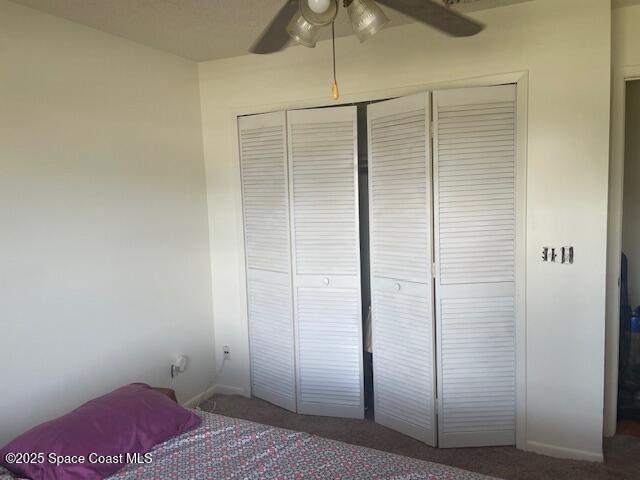 1551 Hardwicke St NW, Palm Bay, FL 32907 - bedroom featuring carpet floors, a closet, and ceiling fan