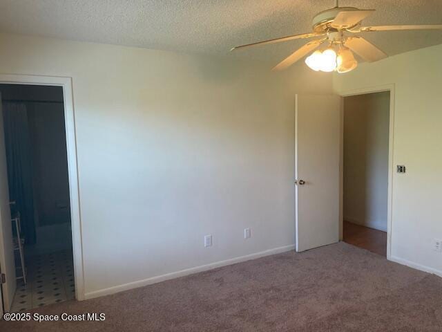 1551 Hardwicke St NW, Palm Bay, FL 32907 - unfurnished bedroom featuring carpet, a textured ceiling, and a ceiling fan