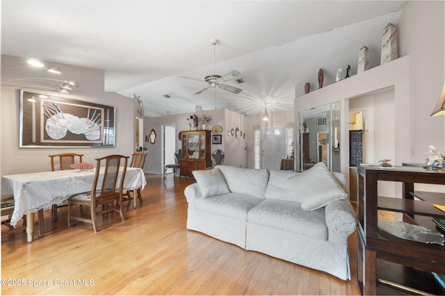225 Chalet Ave, Indialantic, FL 32903 - living room with light wood-style flooring, ceiling fan, and vaulted ceiling