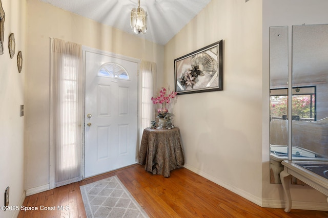 225 Chalet Ave, Indialantic, FL 32903 - entrance foyer with baseboards and wood finished floors