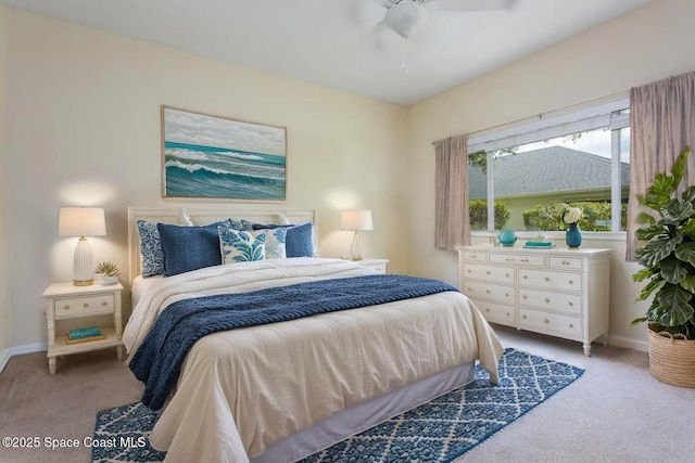 bedroom with carpet flooring, baseboards, and ceiling fan