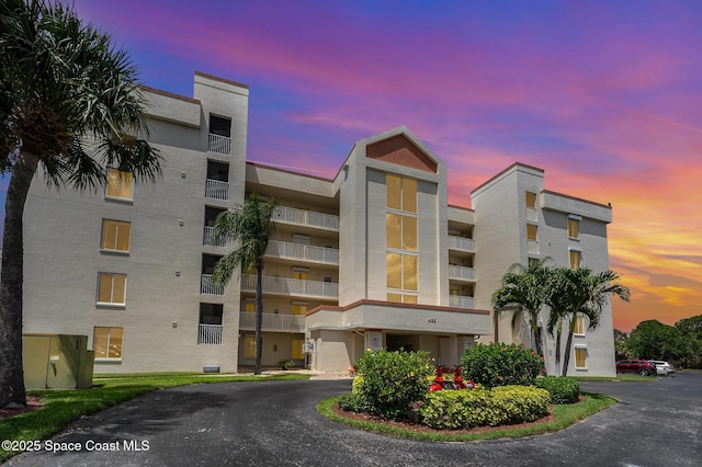 1420 Huntington Ln Unit 2402, Rockledge, FL 32955 - property at dusk with a view of apartment building / complex
