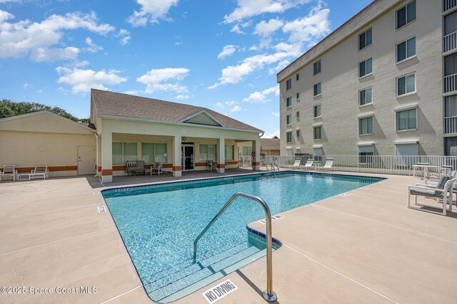 1420 Huntington Ln Unit 2402, Rockledge, FL 32955 - community pool with a patio area