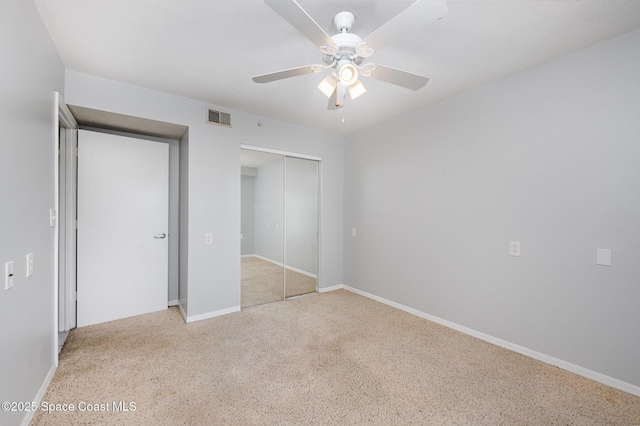 1420 Huntington Ln Unit 2402, Rockledge, FL 32955 - unfurnished bedroom featuring a closet, baseboards, and a ceiling fan
