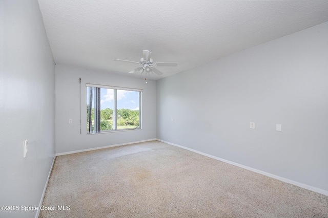 1420 Huntington Ln Unit 2402, Rockledge, FL 32955 - empty room with a ceiling fan, carpet, baseboards, and a textured ceiling