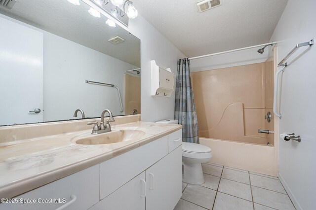 1420 Huntington Ln Unit 2402, Rockledge, FL 32955 - bathroom with toilet, vanity, shower / bathtub combination with curtain, tile patterned flooring, and a textured ceiling