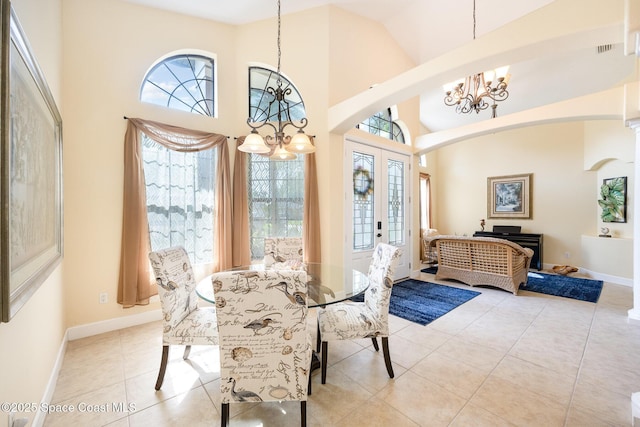 679 Sheridan Woods Dr, Melbourne, FL 32904 - dining space featuring a chandelier, healthy amount of natural light, baseboards, and a high ceiling