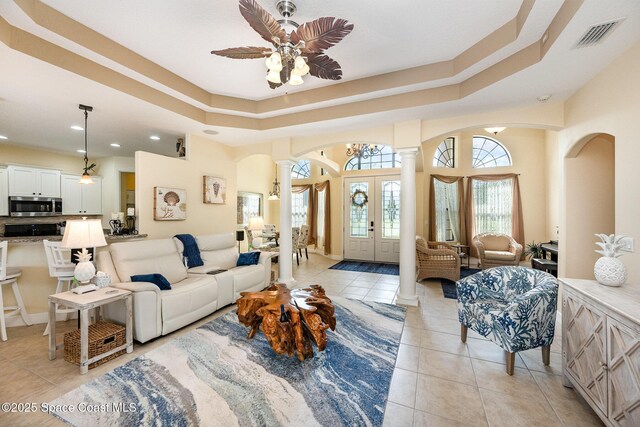679 Sheridan Woods Dr, Melbourne, FL 32904 - living room with ornate columns, arched walkways, light tile patterned floors, a ceiling fan, and recessed lighting