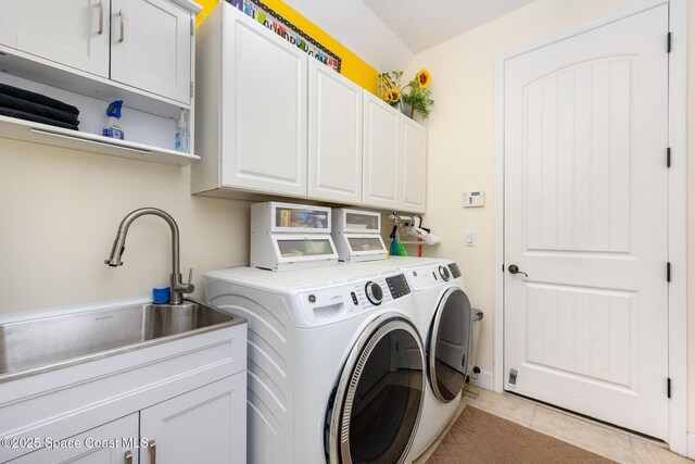 679 Sheridan Woods Dr, Melbourne, FL 32904 - laundry room with independent washer and dryer, cabinet space, and light tile patterned floors