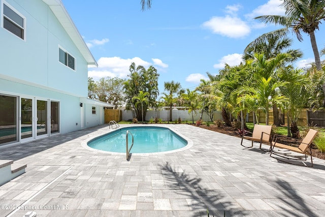view of pool with a patio area and a fenced backyard