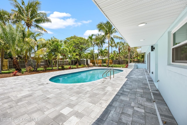 view of pool with a patio area and a fenced backyard
