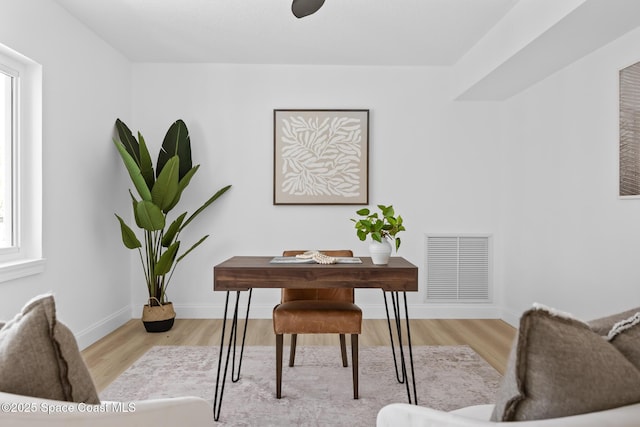 office featuring wood finished floors and baseboards